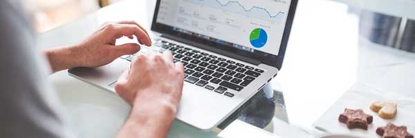 Top 5 SEO Companies to Hire for Your FCs Website laptop graph - Top 5 SEO Companies to Hire for Your FC's Website